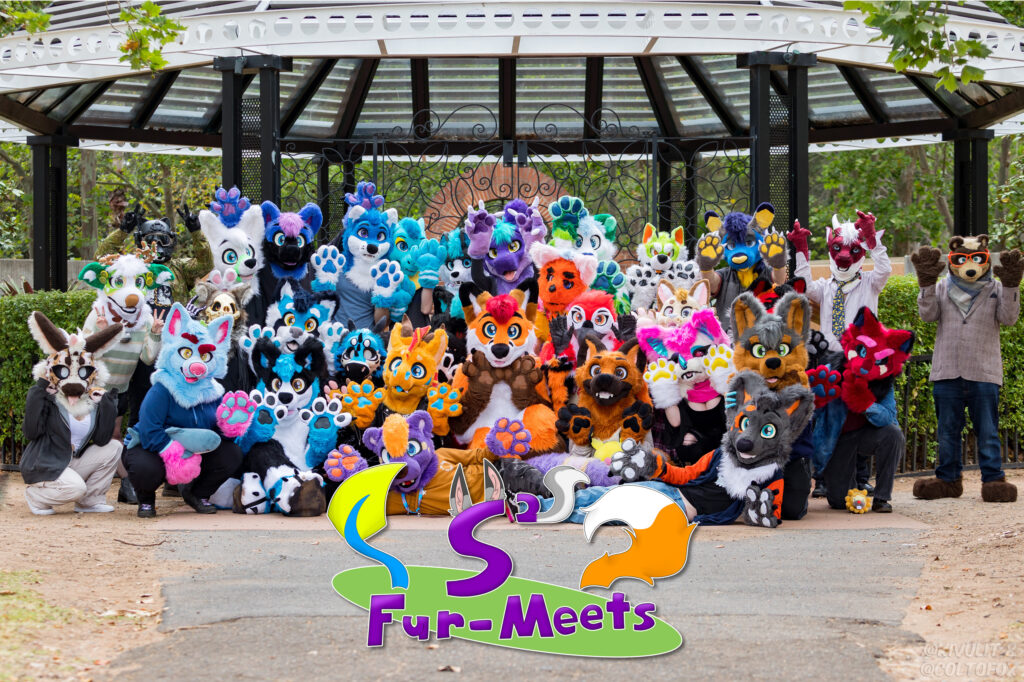 A group photo of lots of colourful fursuiters with an S² Meets logo at the bottom.